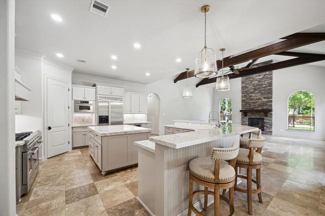 New Updated Quartzite Counter Tops And Island. Custom Painted Cabinets, New Pro-Level Chef's Dream Stove and Double Ovens, With Pot Filler. Tons of Cabinet Space with Huge Walk-In Pantry. | Image 13