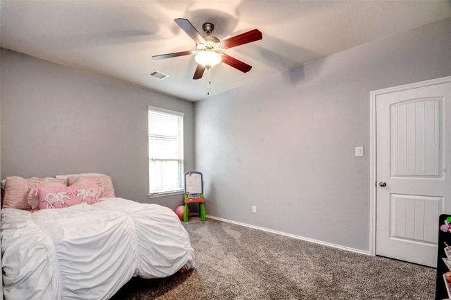 The secondary bedrooms are spacious and bright with generous closet space. | Image 24