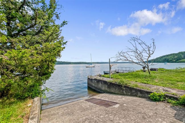 Dock area featuring a boat ramp and a water view | Image 34