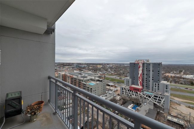 Balcony featuring a city view | Image 23