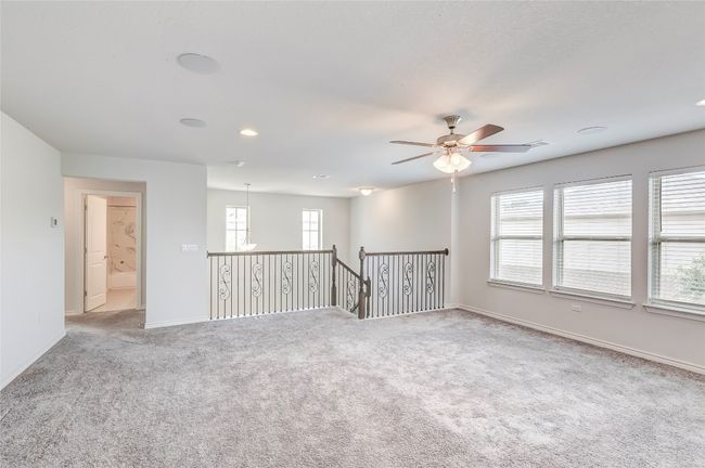 Spare room with carpet flooring, a ceiling fan, baseboards, and recessed lighting | Image 18