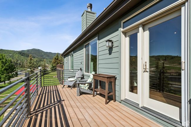 Wooden deck featuring a mountain view | Image 37