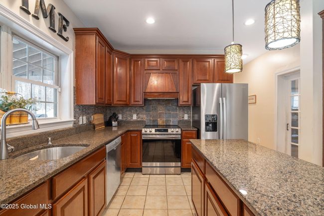 Kitchen features electric cook top and oven (2021) previously gas-can easily be converted back to gas, Refrigerator and dishwasher (2018) | Image 12
