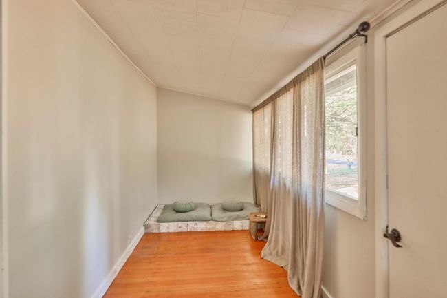 Unfurnished room with hardwood / wood-style flooring and plenty of natural light | Image 22