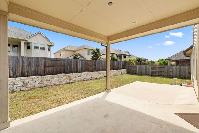 View of patio featuring a residential view and a fenced backyard | Image 36