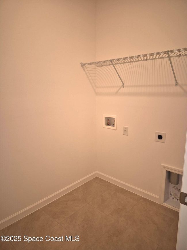 laundry inside hall beside garage | Image 23