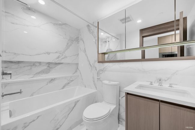 Bathroom featuring vanity, marble finish floors, and recessed lighting | Image 19
