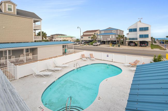 Community pool featuring a residential view and a patio area | Image 7