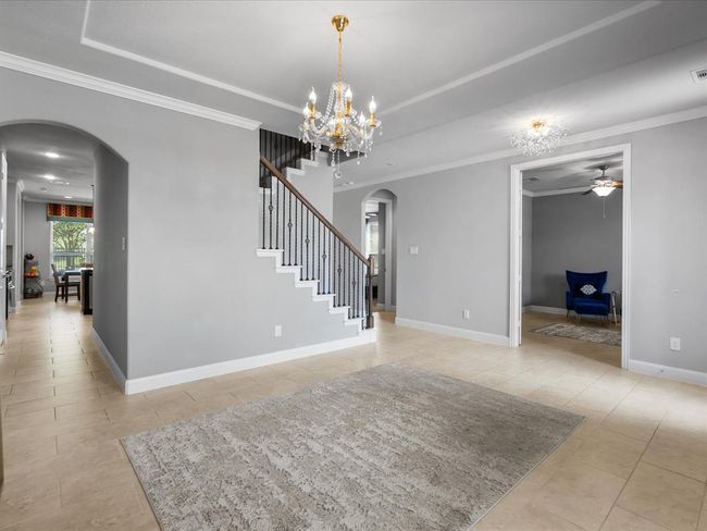 The office/study is bright w/high ceilings, large windows, and French doors, offers quietness and peace while working. | Image 19