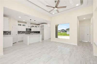 Dining space with sink and ceiling fan | Image 3