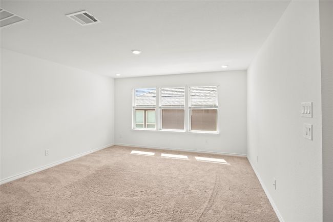 Unfurnished room featuring light colored carpet, baseboards, and recessed lighting | Image 33