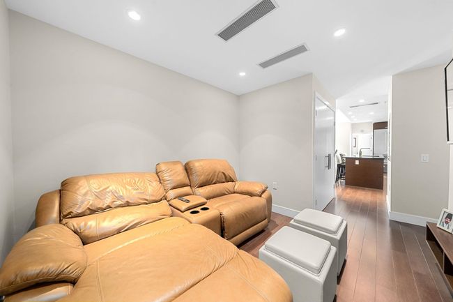 Living room with dark wood finished floors and recessed lighting | Image 23