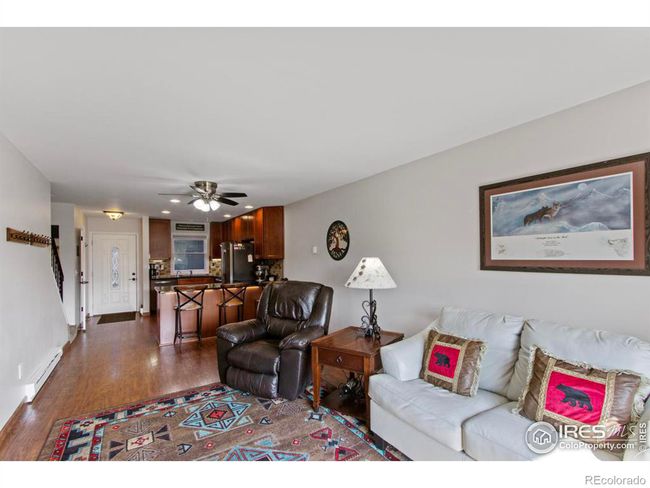 Note the high ceilings on the main level and the Pergo laminate wood floor throughout the main level. | Image 7