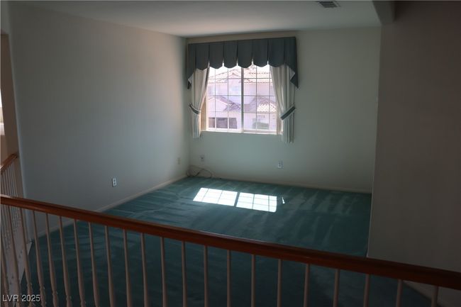 Carpeted empty room with baseboards | Image 41