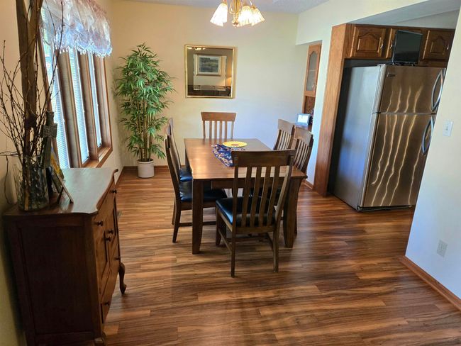The formal dining room overlooks the beautiful back yard | Image 8