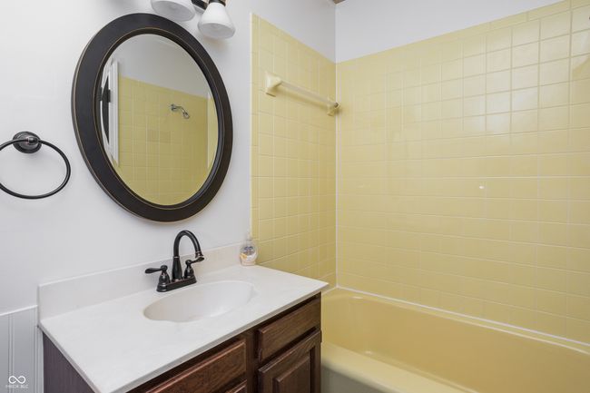 bathroom with vanity and bathing tub / shower combination | Image 23