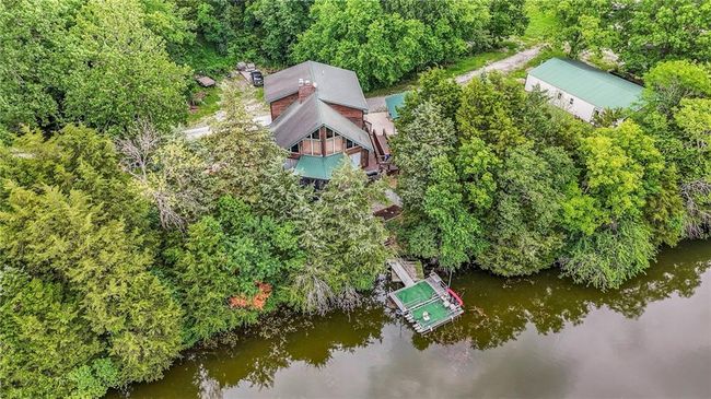 View from above of property with a nearby body of water | Image 64