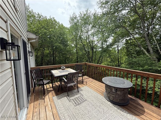 Wooden deck with outdoor dining area | Image 22
