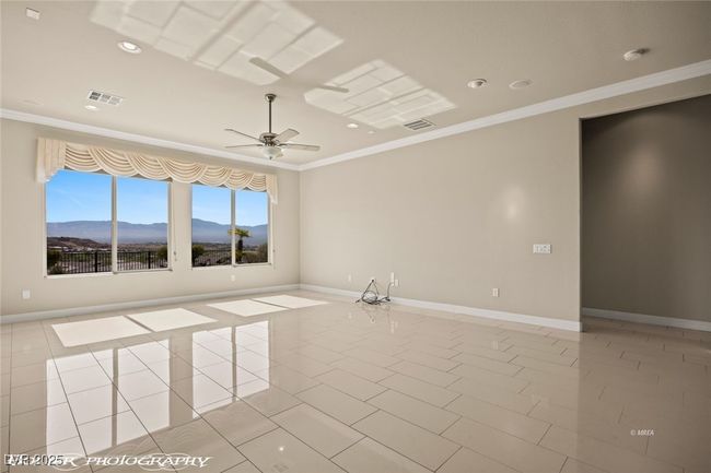Unfurnished room featuring crown molding, visible vents, and baseboards | Image 27