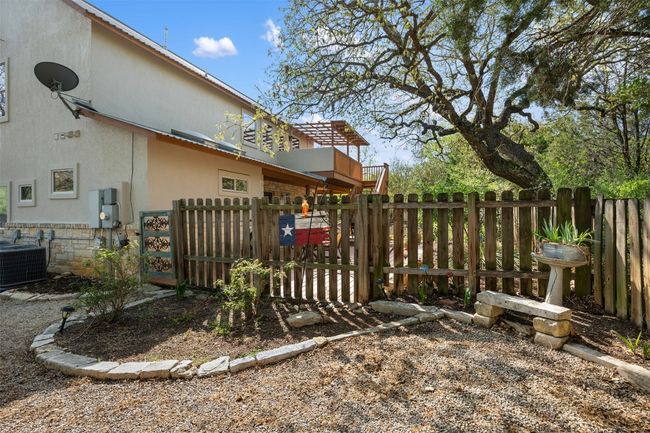 View of yard with fence and central AC | Image 33