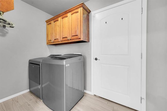 Inside utility, door opens to the garage. | Image 32