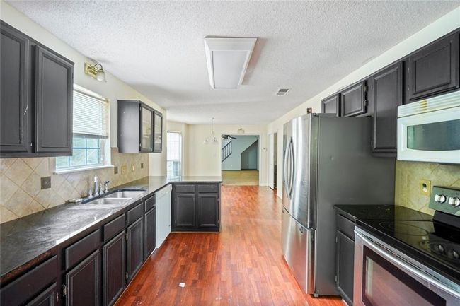 1553 Smithson Ct, House other with 5 bedrooms, 3 bathrooms and 4 parking in Lithonia GA | Image 9