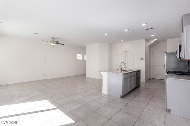 Kitchen with visible vents, appliances with stainless steel finishes, recessed lighting, and a ceiling fan | Image 10