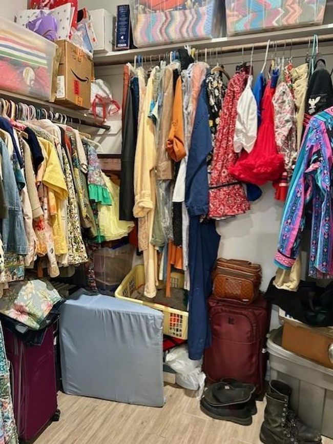 This spacious closet offers ample room for all your clothing needs. | Image 19