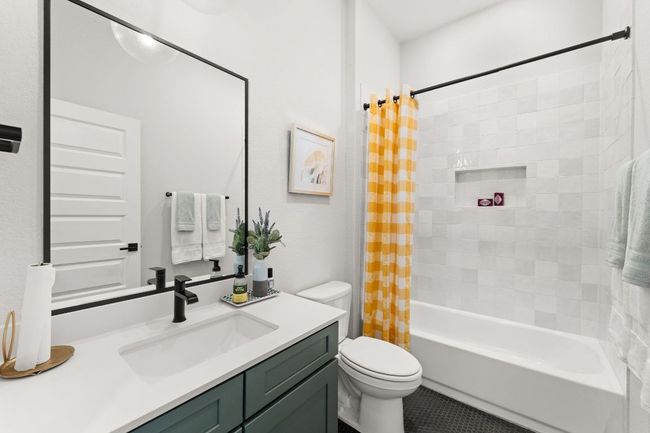 The full guest bathroom features modern finishes and a tub/shower combo. | Image 14