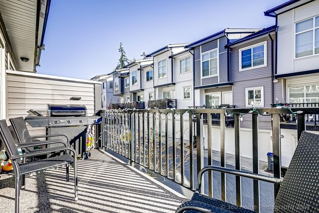 Balcony with grilling area and a residential view | Image 29