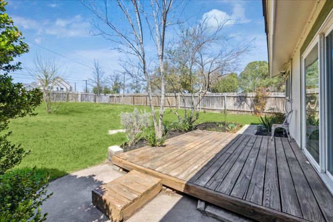 Deck featuring a lawn and a fenced backyard | Image 23