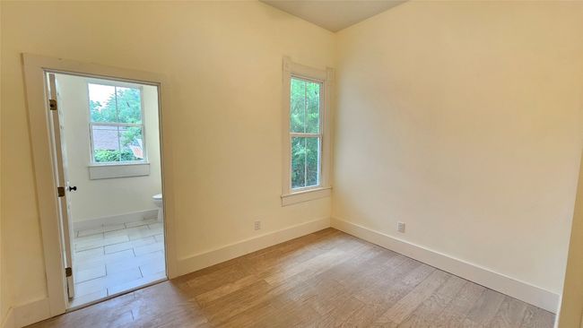 Unfurnished room with plenty of natural light, light wood finished floors, and baseboards | Image 7