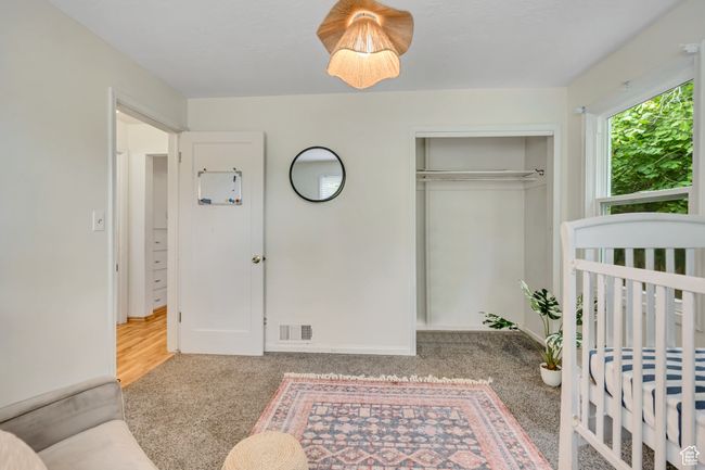 Bedroom with carpet and a closet | Image 9