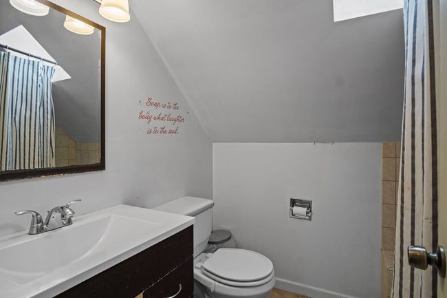 Bathroom featuring vaulted ceiling, vanity, and a shower with curtain | Image 23
