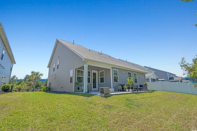Back of property with a patio and central air condition unit | Image 40