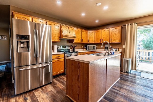 Spacious Kitchen with Island and Stainless Appliances | Image 6