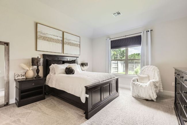 Bedroom featuring light carpet | Image 13