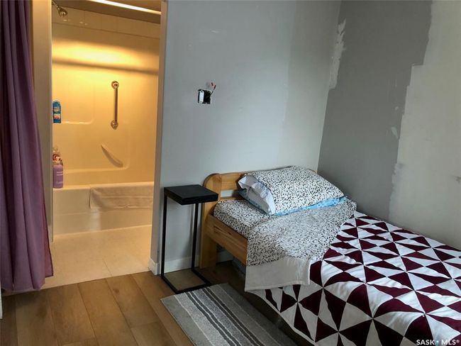 Bedroom with wood finished floors | Image 30