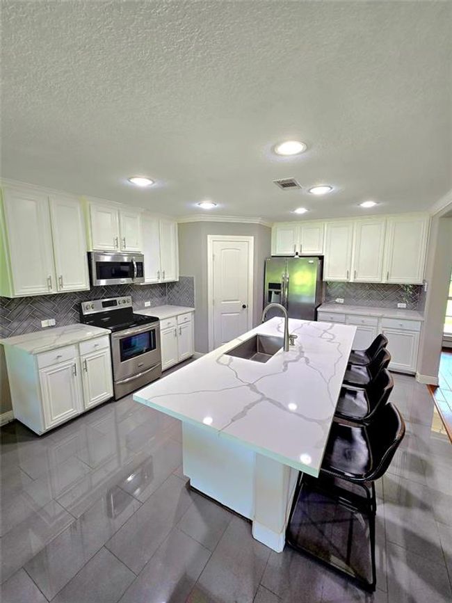 Kitchen island with plenty of room for bar stools. | Image 9