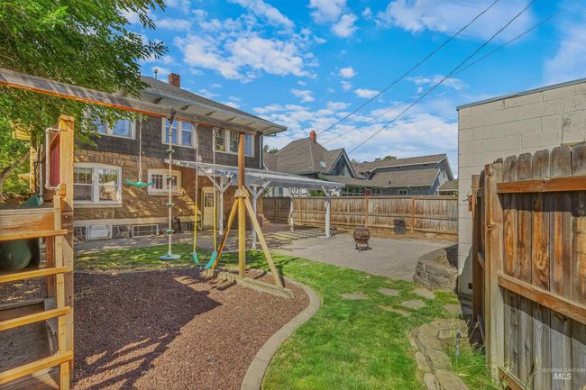 View of play area with a patio and a fenced backyard | Image 49