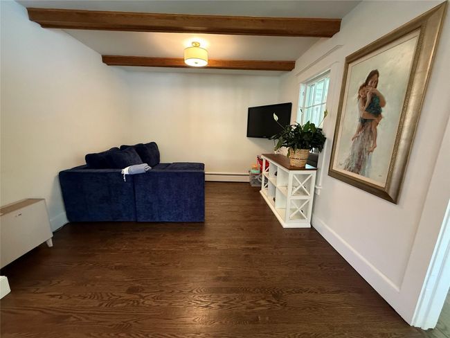 Generously sized living room ideal for relaxing or entertaining guests | Image 6