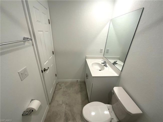 Half bath featuring vanity and toilet | Image 23