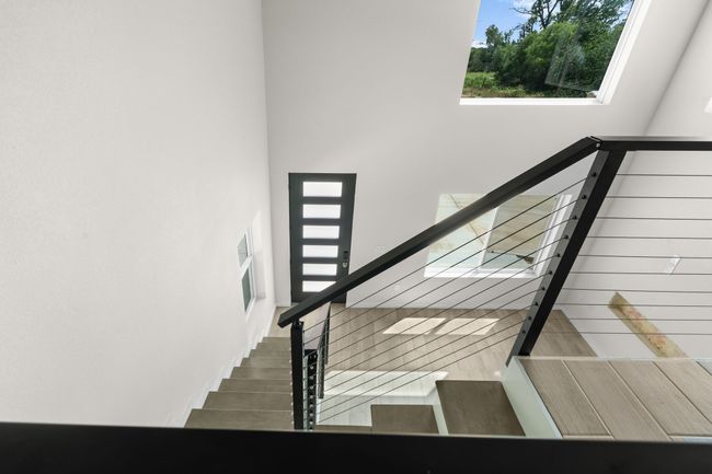 Staircase featuring a high ceiling | Image 15
