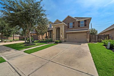 Nestled on a serene cul-de-sac, this home offers a spacious driveway perfect for welcoming guests. | Image 3