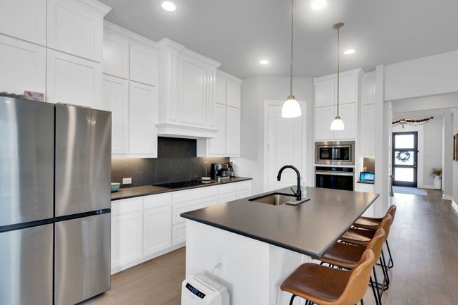 View of kitchen featuring island | Image 9