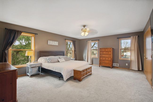 The primary suite is large and spacious with 2 separate walk-in closets and a full private bathroom. | Image 11