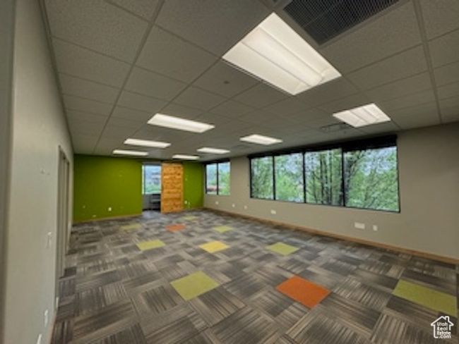 Spare room featuring carpet and a drop ceiling | Image 20