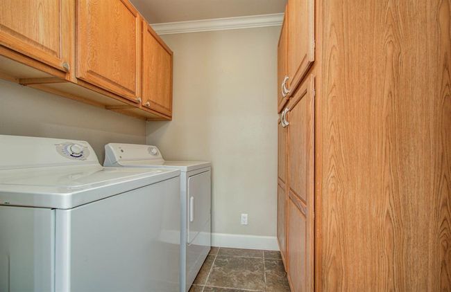 Convenient laundry area with washer and dryer included. | Image 11