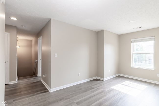 unfurnished room featuring wood finished floors, recessed lighting, and a smoke detector | Image 29
