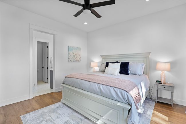 Bedroom featuring recessed lighting, wood finished floors, a ceiling fan, and baseboards | Image 21
